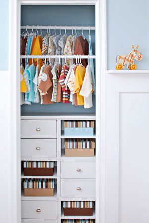 baby closet in blue and white room